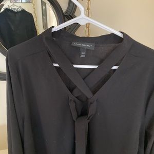 Elegant black blouse with scarf